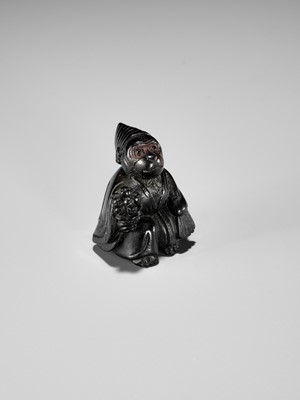 Lot 450 - A CHARMING KUROGAKI (BLACK PERSIMMON) WOOD NETSUKE OF A MONKEY AS A SAMBASO DANCER
