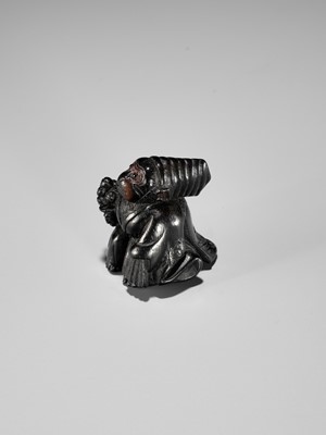 Lot 450 - A CHARMING KUROGAKI (BLACK PERSIMMON) WOOD NETSUKE OF A MONKEY AS A SAMBASO DANCER