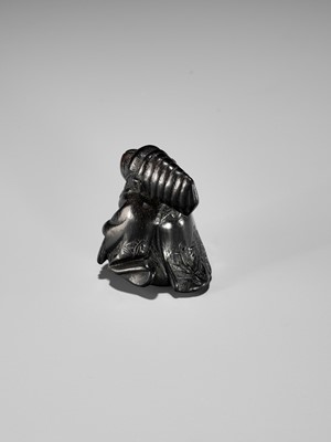 Lot 450 - A CHARMING KUROGAKI (BLACK PERSIMMON) WOOD NETSUKE OF A MONKEY AS A SAMBASO DANCER