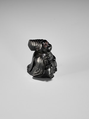 Lot 450 - A CHARMING KUROGAKI (BLACK PERSIMMON) WOOD NETSUKE OF A MONKEY AS A SAMBASO DANCER