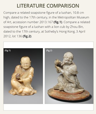 Lot 31 - A RARE SOAPSTONE FIGURE OF VIJRAPUTRA, AKA THE LAUGHING LION LUOHAN OR XIAOSHI LUOHAN, QING DYNASTY