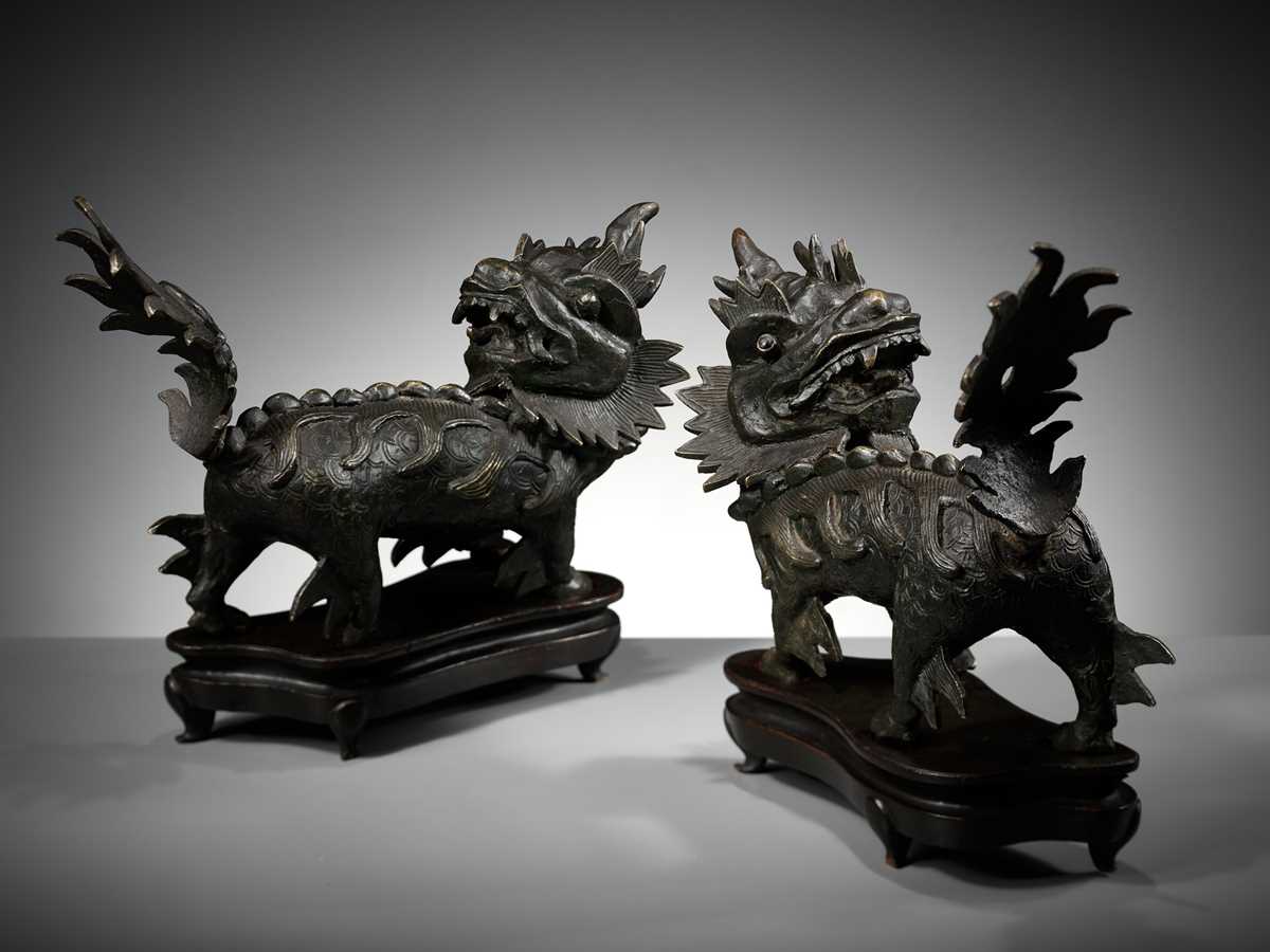 Lot 616 - A PAIR OF HEAVY BRONZE FIGURES OF QILIN, MING DYNASTY