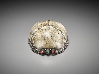 Lot 678 - A SILVER-MOUNTED ‘CITIPATI’ KAPALA WITH CORAL AND TURQUOISE CABOCHONS, TIBET, 18TH-19TH CENTURY