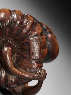 Lot 355 - TOMONOBU: A WOOD NETSUKE OF A FROG, NASUBI AND PUMPKIN
