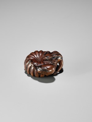 Lot 355 - TOMONOBU: A WOOD NETSUKE OF A FROG, NASUBI AND PUMPKIN