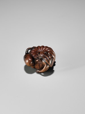Lot 355 - TOMONOBU: A WOOD NETSUKE OF A FROG, NASUBI AND PUMPKIN