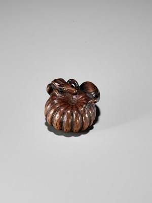 Lot 355 - TOMONOBU: A WOOD NETSUKE OF A FROG, NASUBI AND PUMPKIN