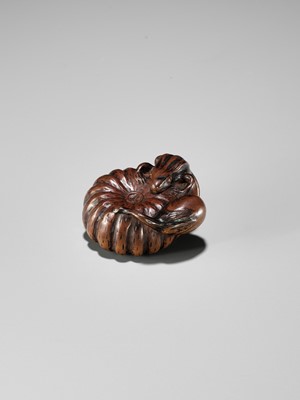 Lot 355 - TOMONOBU: A WOOD NETSUKE OF A FROG, NASUBI AND PUMPKIN