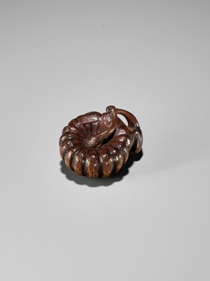 Lot 355 - TOMONOBU: A WOOD NETSUKE OF A FROG, NASUBI AND PUMPKIN