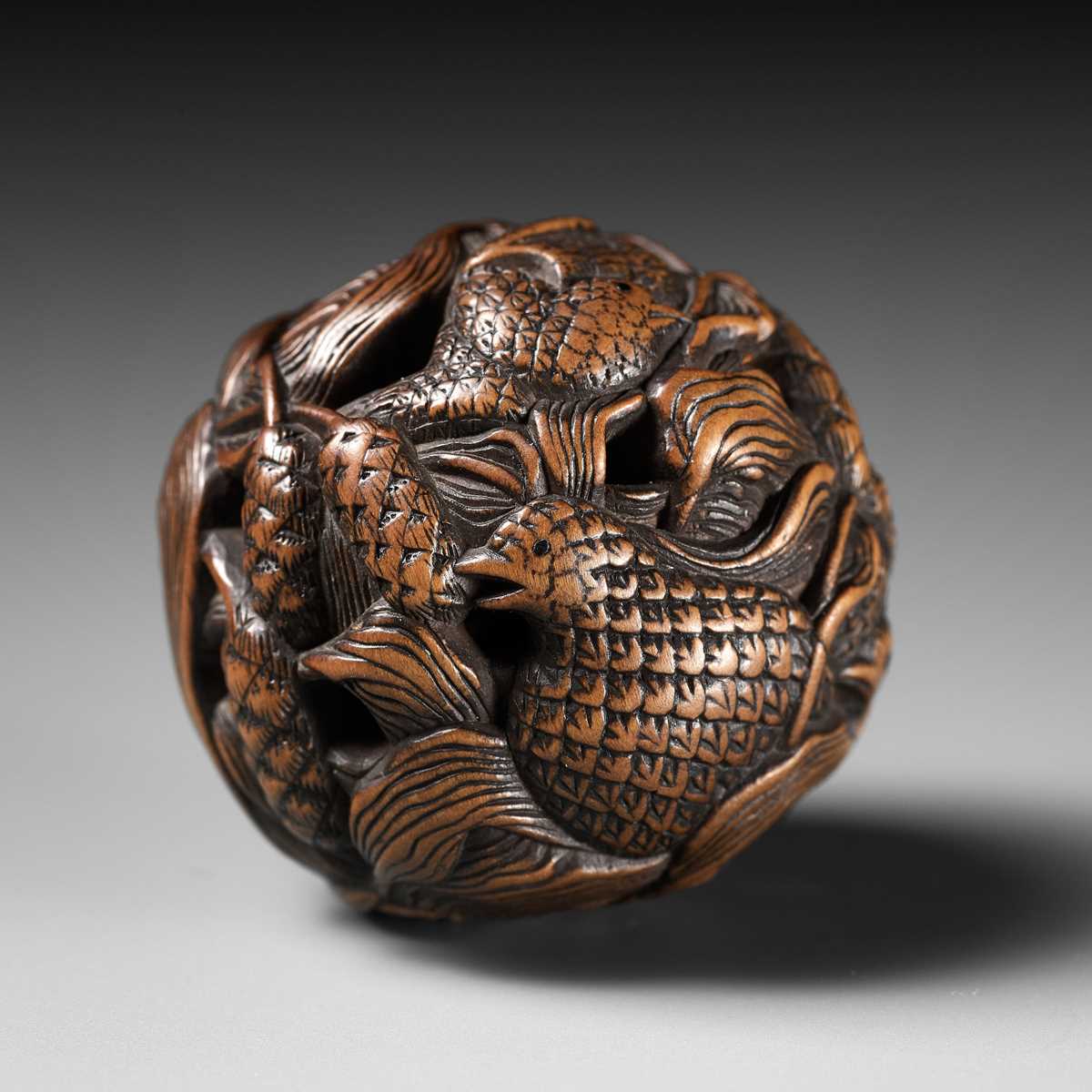 Lot 82 - MASANAO: A FINE WOOD NETSUKE DEPICTING AN AUTUMNAL SCENE OF QUAILS AND MILLET