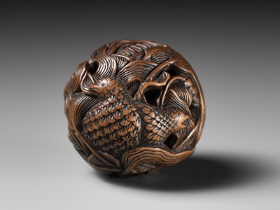 Lot 82 - MASANAO: A FINE WOOD NETSUKE DEPICTING AN AUTUMNAL SCENE OF QUAILS AND MILLET