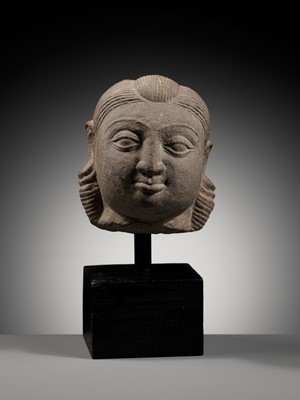 Lot 718 - A PINK SANDSTONE HEAD OF A YAKSHI, MATHURA, KUSHAN PERIOD