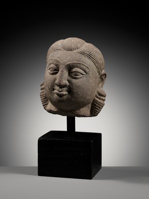 Lot 718 - A PINK SANDSTONE HEAD OF A YAKSHI, MATHURA, KUSHAN PERIOD