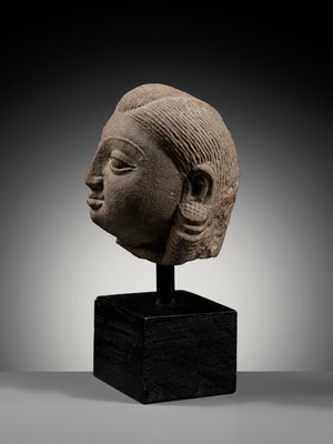 Lot 718 - A PINK SANDSTONE HEAD OF A YAKSHI, MATHURA, KUSHAN PERIOD