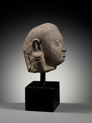 Lot 718 - A PINK SANDSTONE HEAD OF A YAKSHI, MATHURA, KUSHAN PERIOD