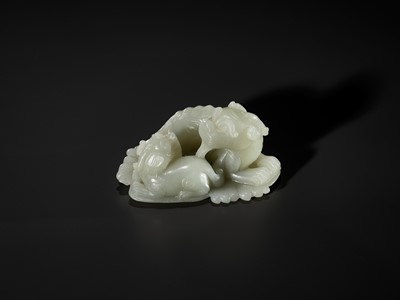 Lot 343 - A PALE CELADON JADE ‘QILIN AND YOUNG’ GROUP, MID-QING DYNASTY