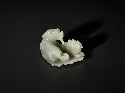 Lot 343 - A PALE CELADON JADE ‘QILIN AND YOUNG’ GROUP, MID-QING DYNASTY