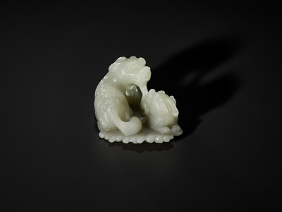 Lot 343 - A PALE CELADON JADE ‘QILIN AND YOUNG’ GROUP, MID-QING DYNASTY