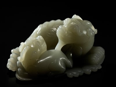 Lot 343 - A PALE CELADON JADE ‘QILIN AND YOUNG’ GROUP, MID-QING DYNASTY