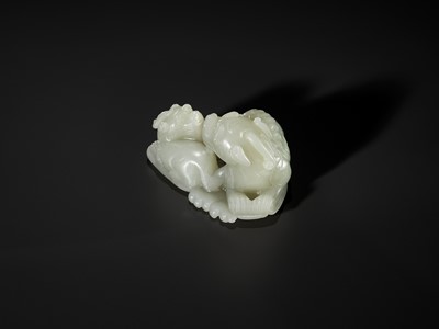 Lot 343 - A PALE CELADON JADE ‘QILIN AND YOUNG’ GROUP, MID-QING DYNASTY