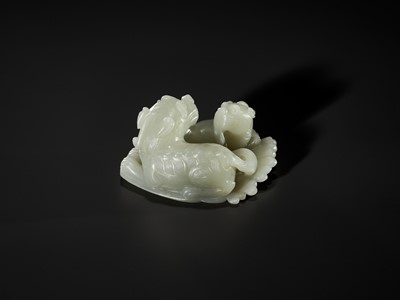 Lot 343 - A PALE CELADON JADE ‘QILIN AND YOUNG’ GROUP, MID-QING DYNASTY