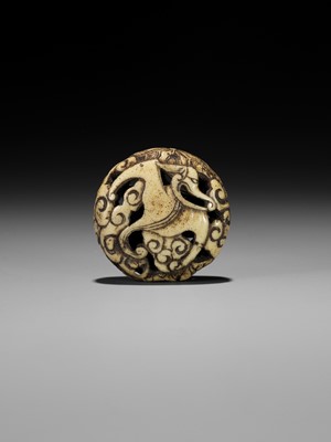 Lot 477 - A RARE ANTLER RYUSA MANJU NETSUKE OF A STYLIZED ‘BAT’ DRAGON