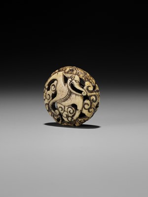 Lot 477 - A RARE ANTLER RYUSA MANJU NETSUKE OF A STYLIZED ‘BAT’ DRAGON