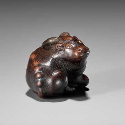 Lot 677 - MASAKAZU: A FINE WOOD NETSUKE OF A RECUMBENT GOAT