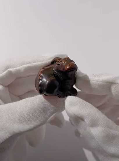 Lot 677 - MASAKAZU: A FINE WOOD NETSUKE OF A RECUMBENT
