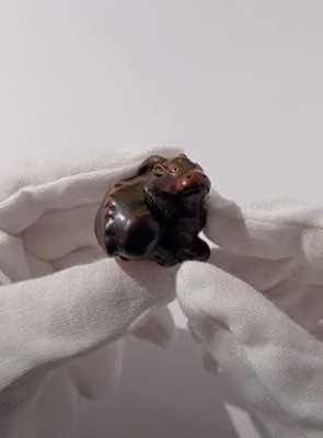 Lot 677 - MASAKAZU: A FINE WOOD NETSUKE OF A RECUMBENT