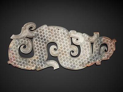 A LARGE WHITE AND RUSSET JADE ‘DRAGON’ PENDANT, EASTERN ZHOU DYNASTY