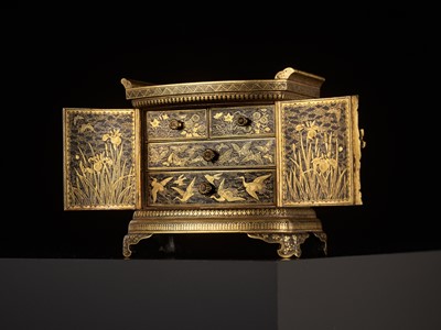 Lot 113 - KOMAI: A SUPERB GOLD-DAMASCENED IRON TABLE CABINET (KODANSU)
