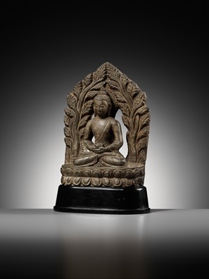 Lot 668 - A LIMESTONE FIGURE OF BUDDHA AMITABHA UNDER THE BODHI TREE, NEPAL, 17TH-18TH CENTURY