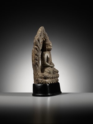 Lot 668 - A LIMESTONE FIGURE OF BUDDHA AMITABHA UNDER THE BODHI TREE, NEPAL, 17TH-18TH CENTURY