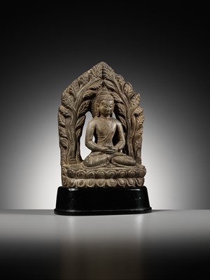 Lot 668 - A LIMESTONE FIGURE OF BUDDHA AMITABHA UNDER THE BODHI TREE, NEPAL, 17TH-18TH CENTURY
