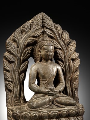Lot 668 - A LIMESTONE FIGURE OF BUDDHA AMITABHA UNDER THE BODHI TREE, NEPAL, 17TH-18TH CENTURY