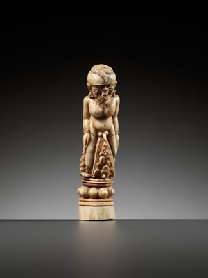 Lot 691 - A CARVED BONE KRIS HILT IN THE FORM OF A MALE DEMON, INDONESIA, 18TH-19TH CENTURY