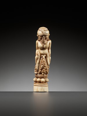 Lot 691 - A CARVED BONE KRIS HILT IN THE FORM OF A MALE DEMON, INDONESIA, 18TH-19TH CENTURY