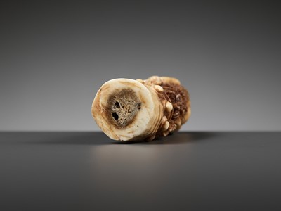 Lot 691 - A CARVED BONE KRIS HILT IN THE FORM OF A MALE DEMON, INDONESIA, 18TH-19TH CENTURY