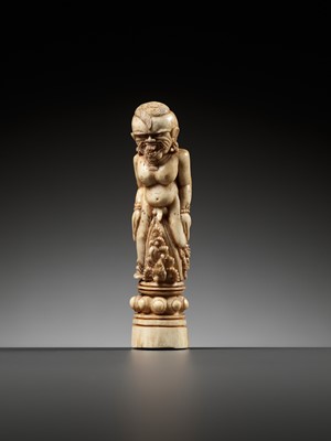 Lot 691 - A CARVED BONE KRIS HILT IN THE FORM OF A MALE DEMON, INDONESIA, 18TH-19TH CENTURY