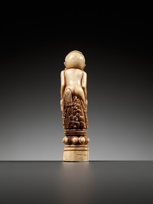 Lot 691 - A CARVED BONE KRIS HILT IN THE FORM OF A MALE DEMON, INDONESIA, 18TH-19TH CENTURY