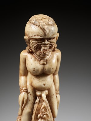 Lot 691 - A CARVED BONE KRIS HILT IN THE FORM OF A MALE DEMON, INDONESIA, 18TH-19TH CENTURY