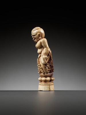 Lot 691 - A CARVED BONE KRIS HILT IN THE FORM OF A MALE DEMON, INDONESIA, 18TH-19TH CENTURY
