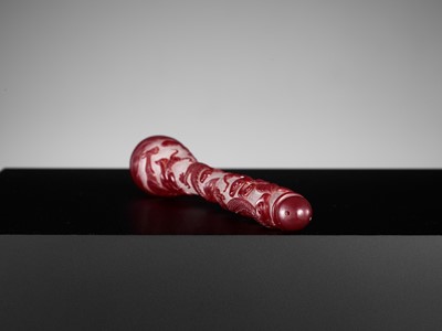Lot 22 - A CARVED RED OVERLAY SNOWFLAKE GLASS ‘DRAGON’ BRUSH HANDLE, QING DYNASTY