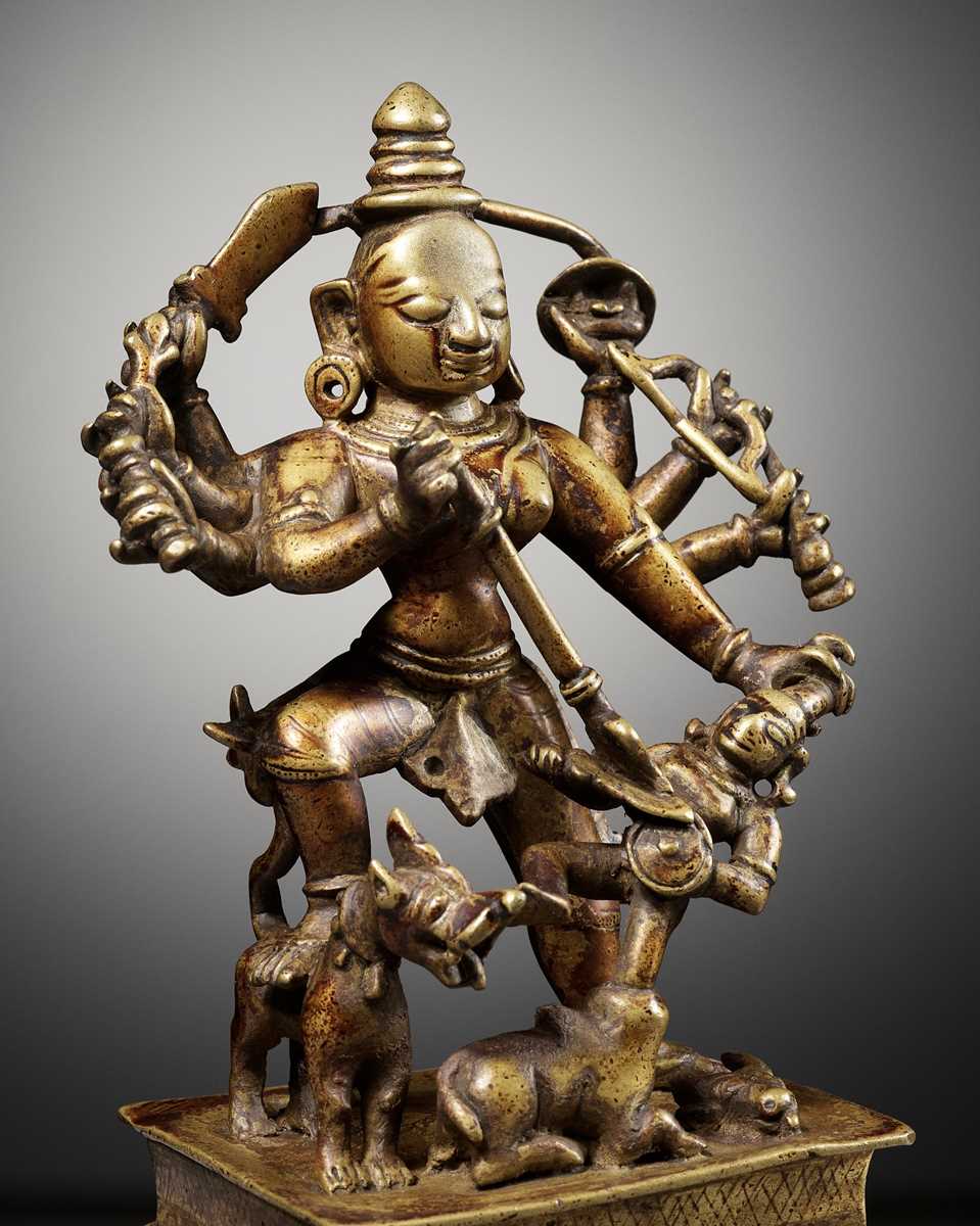 Lot 730 - A BRASS FIGURE OF DURGA MAHISHASURAMARDINI, INDIA, 16TH-17TH CENTURY
