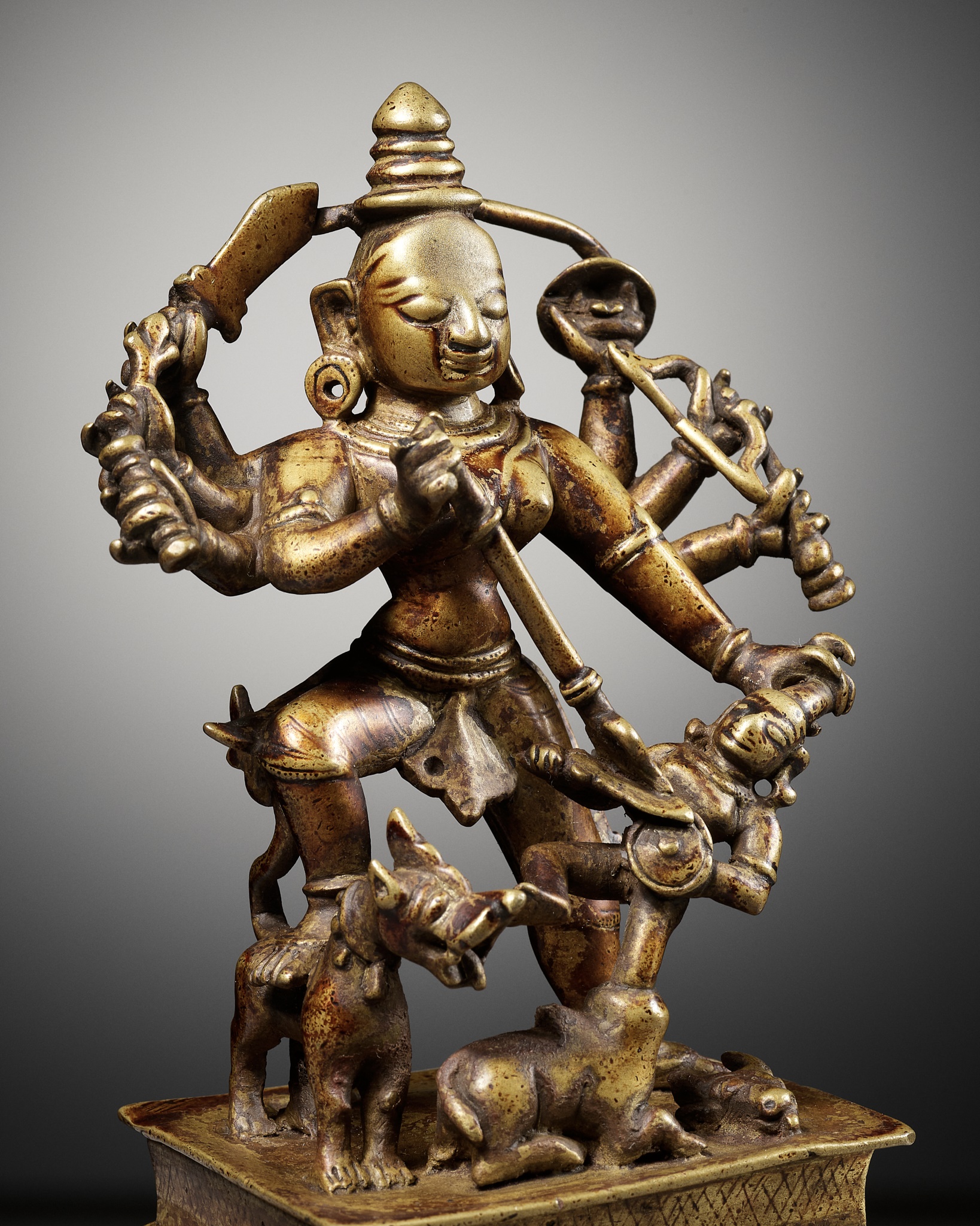 Lot 730 - A BRASS FIGURE OF DURGA MAHISHASURAMARDINI,