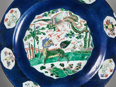 Lot 193 - A LARGE POWDER BLUE FAMILLE-VERTE ‘QILIN AND PHOENIX’ CHARGER, KANGXI PERIOD