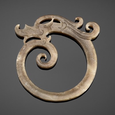 Lot 842 - A JADE RING ORNAMENT IN FORM OF A COILED DRAGON, WESTERN HAN