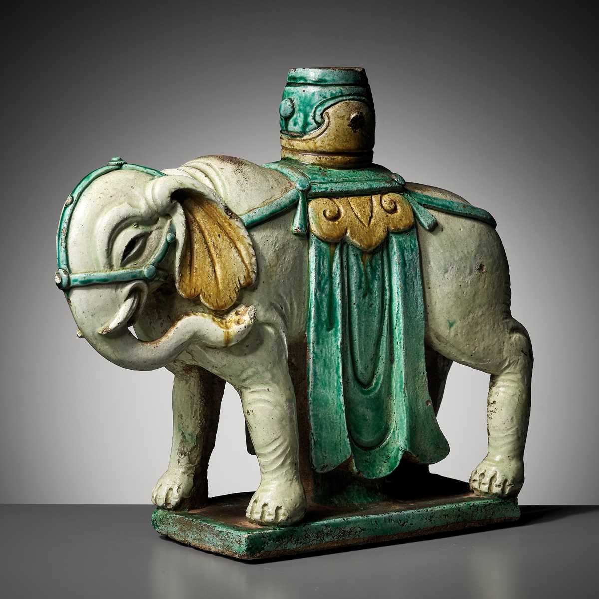 Lot 77 - A SANCAI-GLAZED ‘ELEPHANT’ CANDLEHOLDER, MING DYNASTY