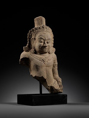Lot 709 - A SANDSTONE BUST OF A DEMON, ASURA, ANGKOR PERIOD